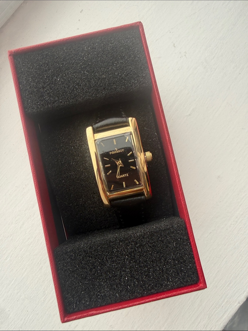 Peugeot Gold-Tone Rectangular Watch with Black Dial and Black Strap